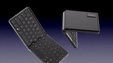 a black keyboard PC folded in half